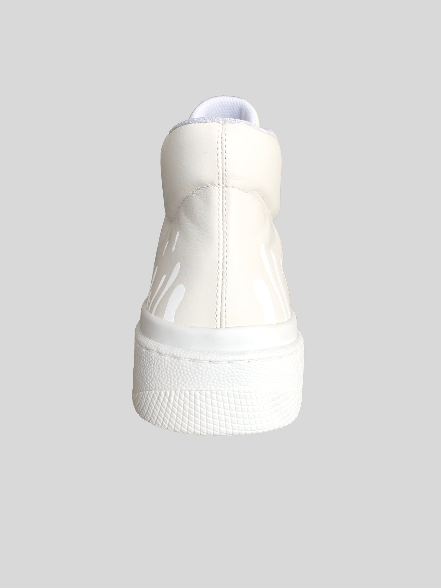 Back view of cream Chrome-free Nappa leather mid-top sneakers with exclusive printed white drops design and white soles