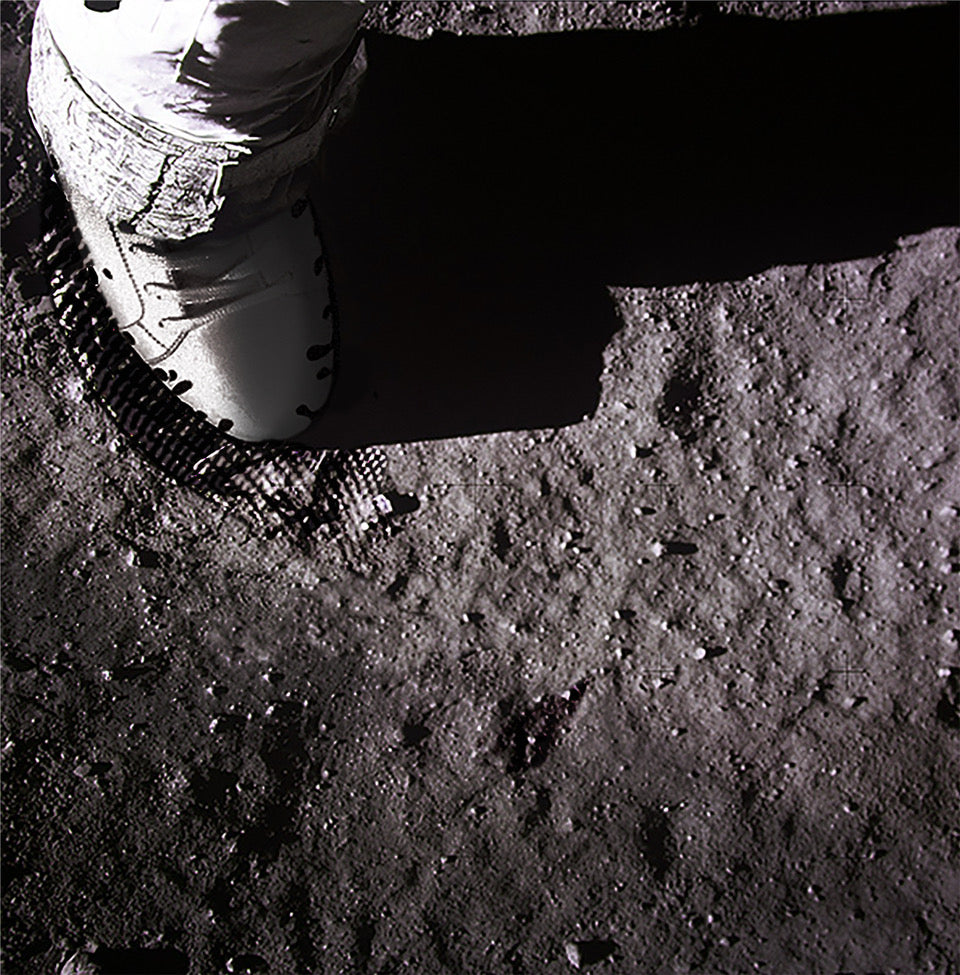 Foot wearing 33MB exclusive design sneaker on the moon