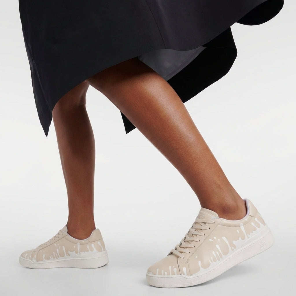 33MB Dawn low-top sneakers styled with a black skirt, highlighting the sleek urban silhouette and breathable mesh lining.