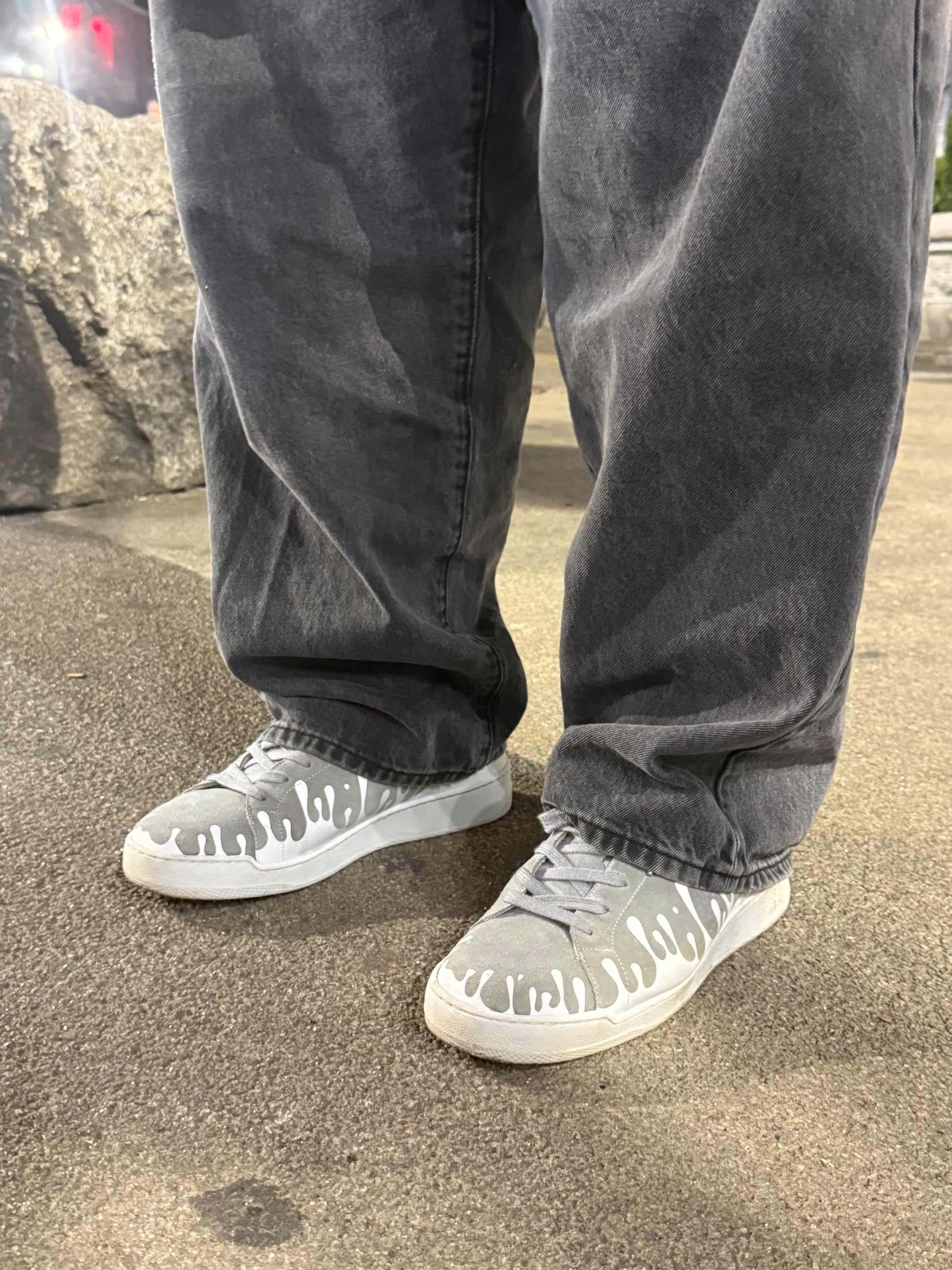 Pair of grey suede low-top sneakers with exclusive printed white drops design and white soles