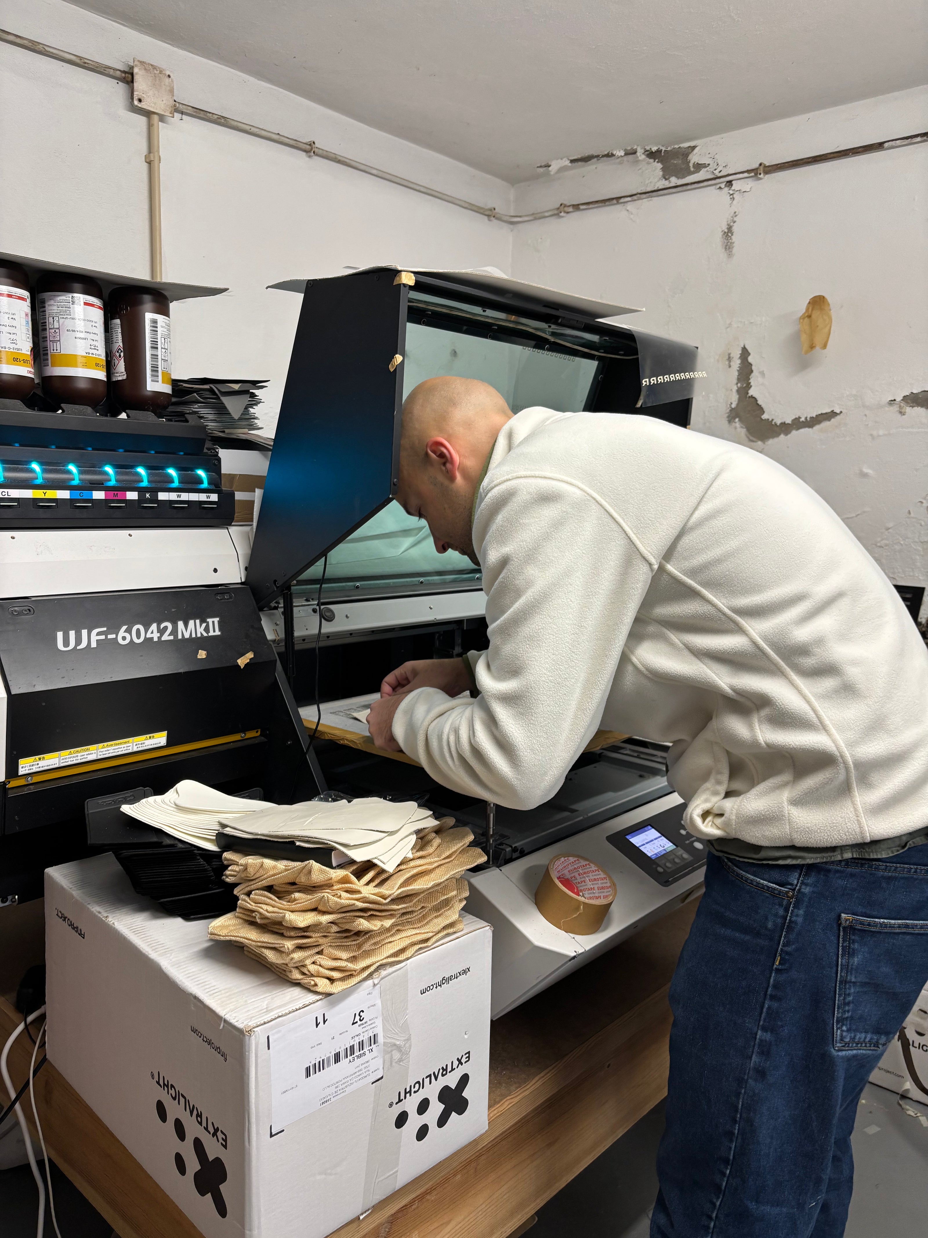 Man standig in front of a printer