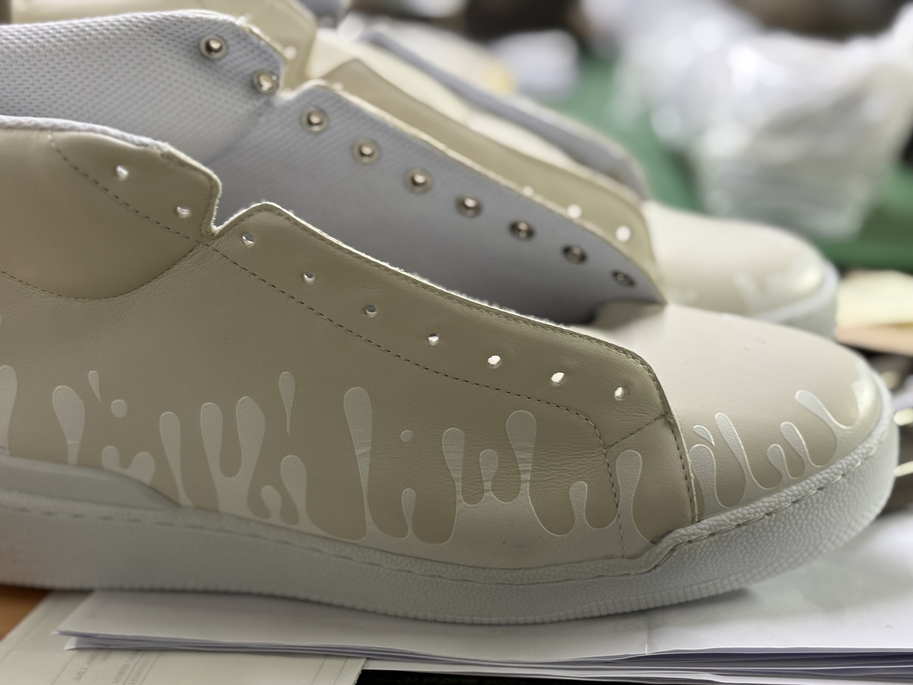 Pair of Cream color Nappa leather mid-top sneakers with exclusive printed white drops design and white soles