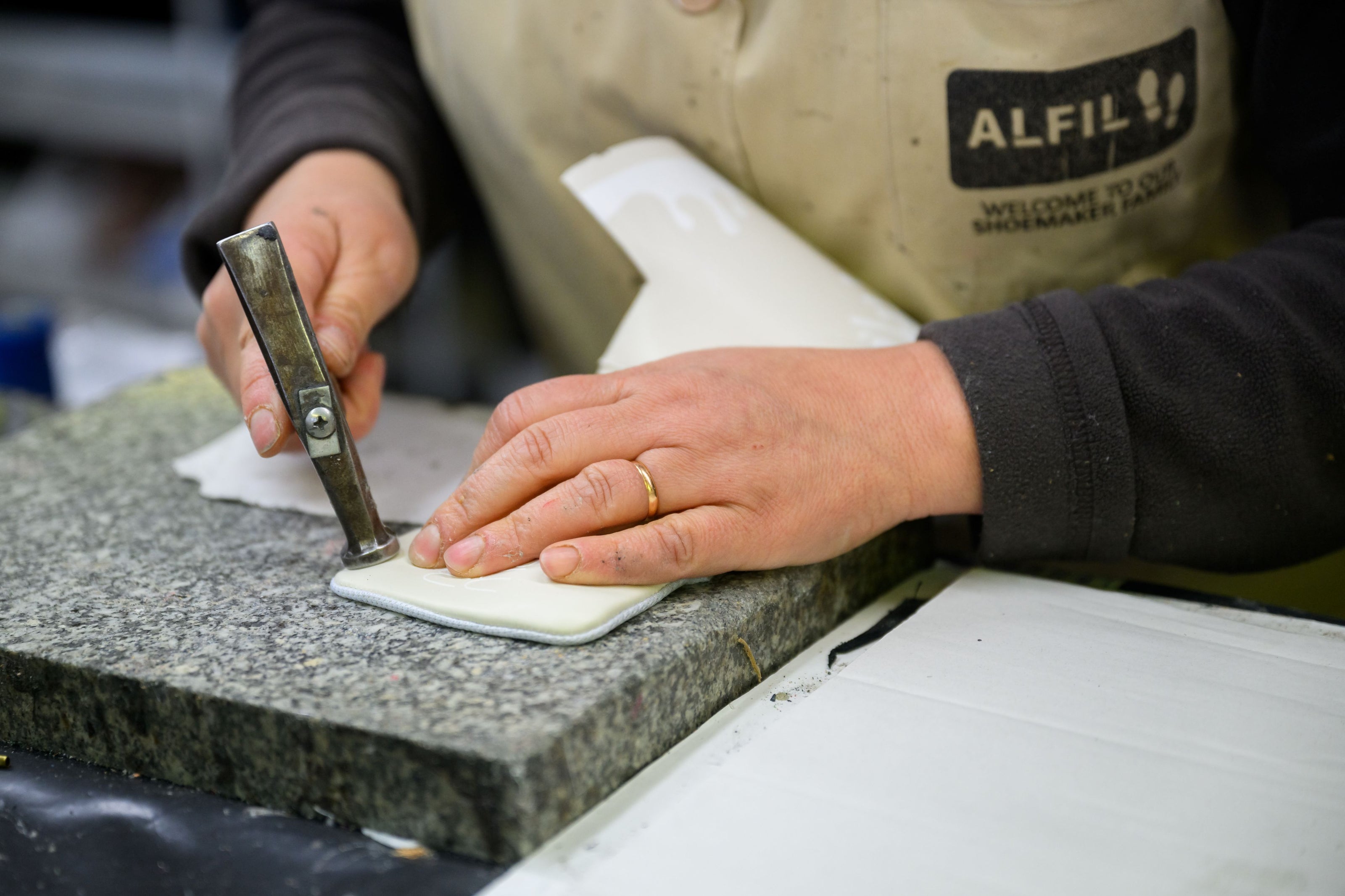 Artisan shaping our 33MB premium leather sneaker