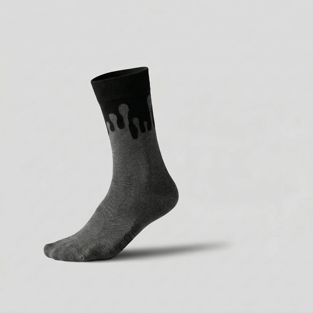 Eclipse monochromatic dark grey and black sock featuring the 33MB Zero Gravity© signature design worn on a foot