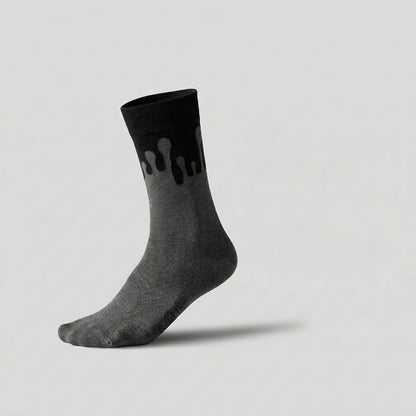 Eclipse monochromatic dark grey and black sock featuring the 33MB Zero Gravity© signature design worn on a foot