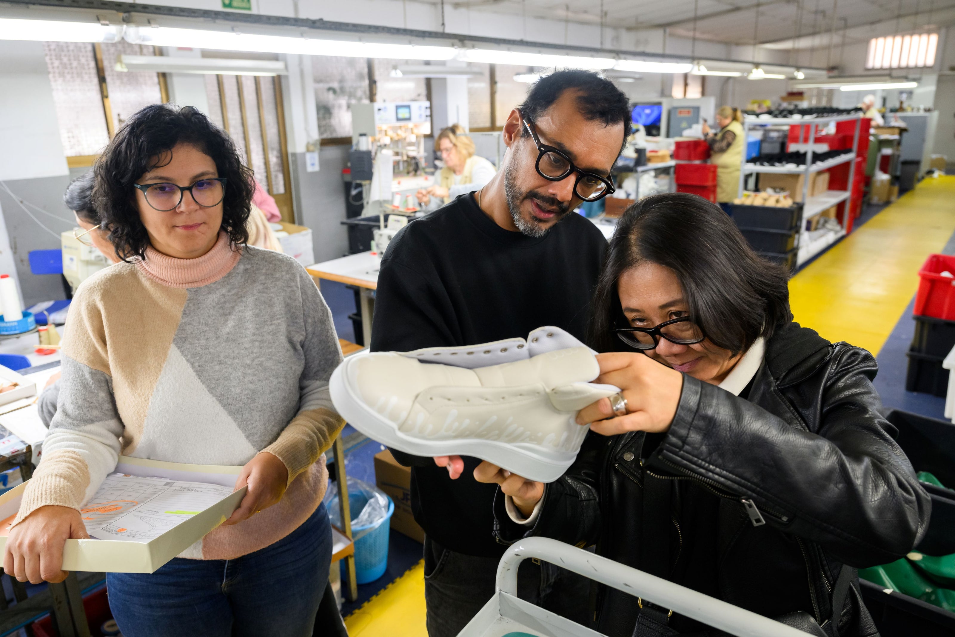 Miguel and Xuan checking the quality of our 33MB premium leather sneaker