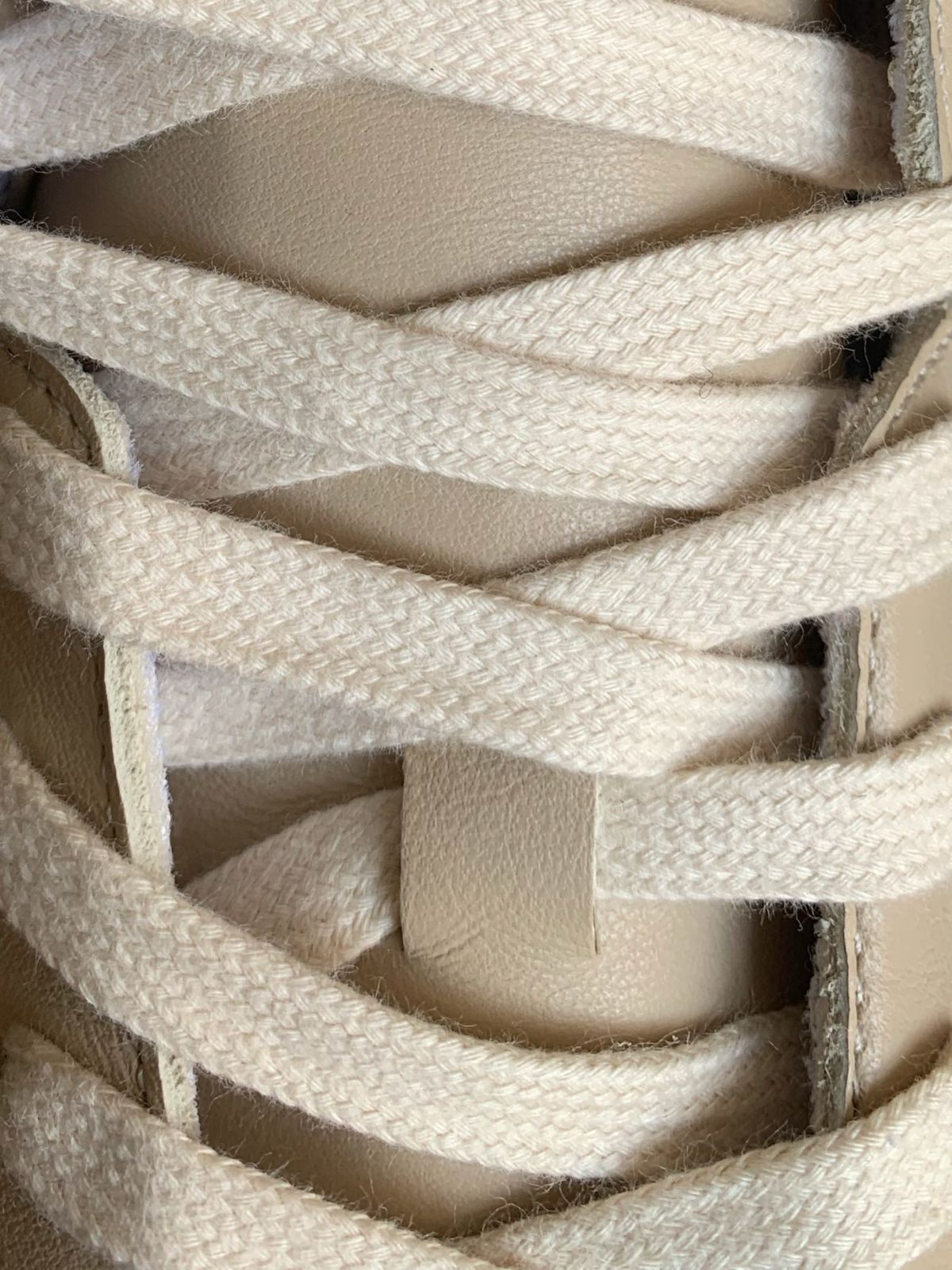 Lace stopper on premium leather sneaker