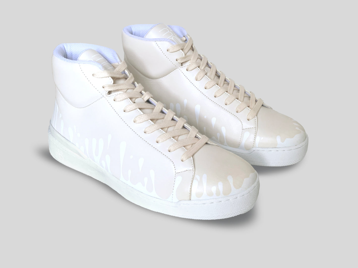 Pair of cream Chrome-free Nappa leather mid-top sneakers with exclusive printed white drops design and white soles