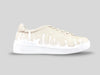 Side profile of 33MB Dawn low-top sneakers in cream leather, showcasing the subtle white Zero Gravity paint drops traveling upward from the sole.