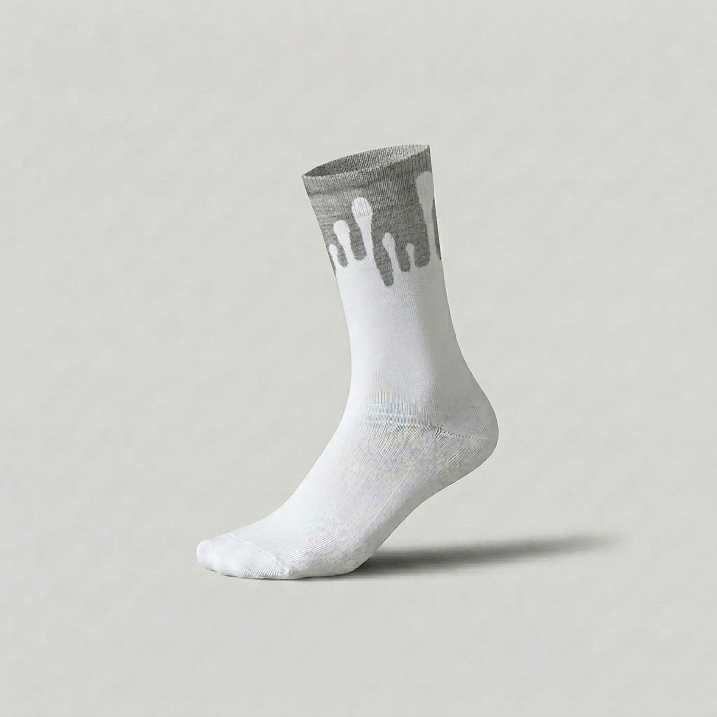 Lunar white and light grey socks showcasing the 33MB Zero Gravity© upward drop design on a minimalist background.
