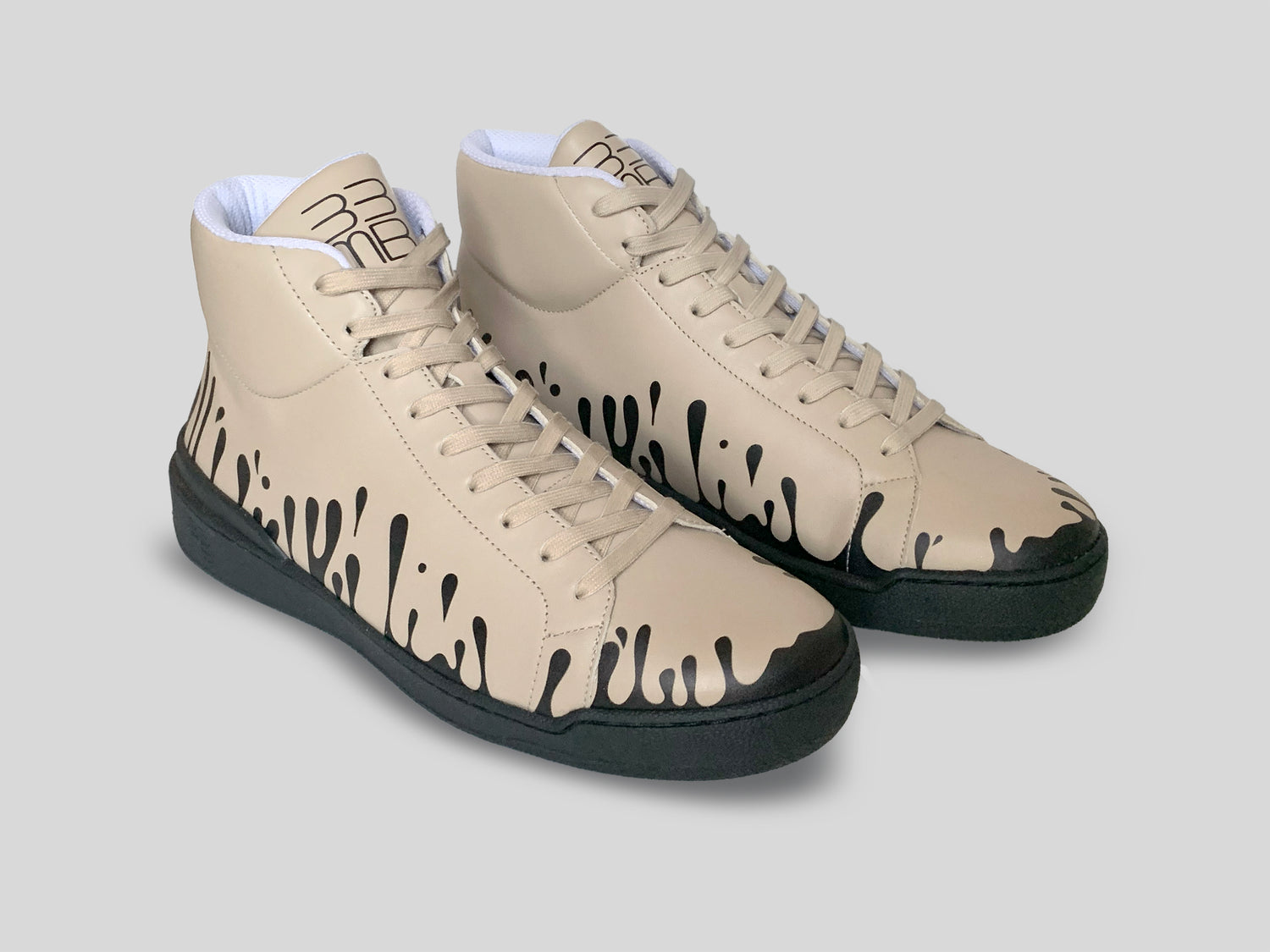 Pair of beige Nappa leather mid-top sneakers with exclusive printed black drops design and black soles
