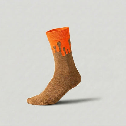 Solar orange and camel socks showcasing the 33MB Zero Gravity© signature motif with upward drops symbolizing hope.