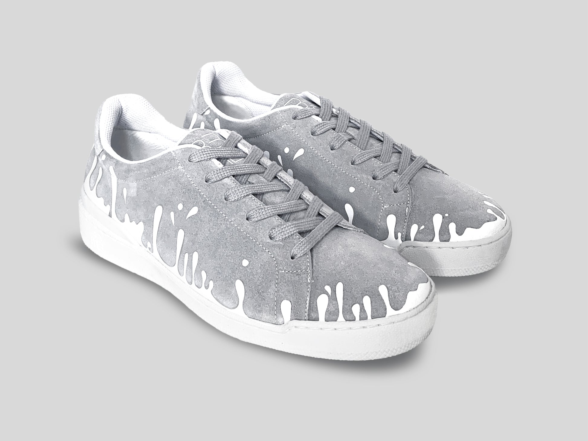 Pair of grey suede low-top sneakers with exclusive printed white drops design and white soles