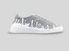 Side profile of 33MB Splash low-top sneakers in dark grey suede, featuring white Zero Gravity®  paint drops traveling upward from the sole.