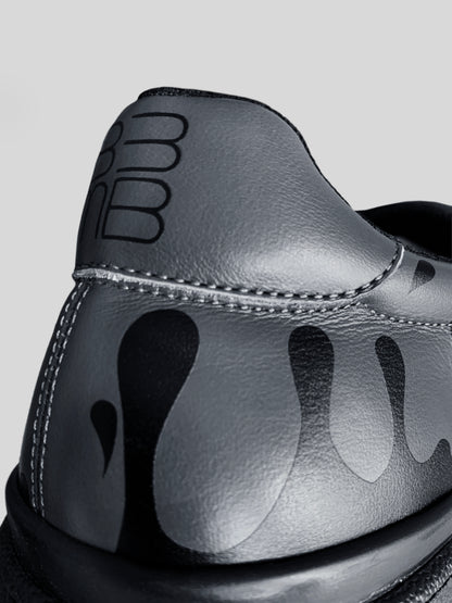 Back focus of dark grey Chrome-free Nappa leather low-top sneaker with exclusive printed black drops design