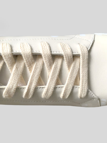 Focus on cream color laces on cream Chrome-Free Nappa leather sneakers